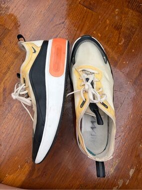 Nike Men’s Yellow, Black & White Athletic Sneakers with Orange Accent
